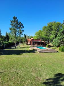 a house with a swimming pool in a park at Casas de Campo in Santa María