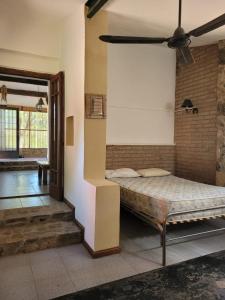 a bedroom with a bed in a room at Casas de Campo in Santa María