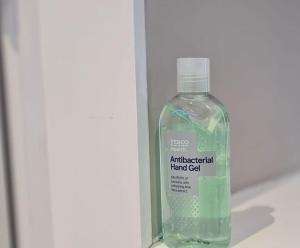a bottle of antibacterial hand gel in a box at Stylish & modern studio in Burnley in Burnley