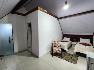 Postel nebo postele na pokoji v ubytování Espaço Chalé Cereja