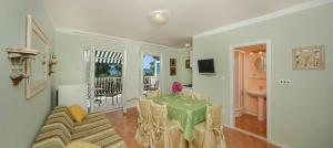 a living room with a table and a couch at Villa Tamara in Zavala