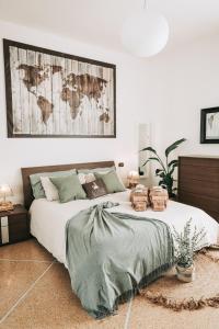 a bedroom with a bed with a map on the wall at A Casa dello Steno - Unicità Rustica in Bologna