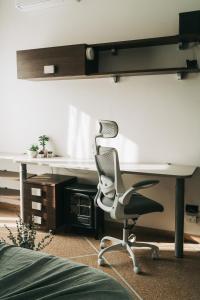 an office with a desk and a chair in a room at A Casa dello Steno - Unicità Rustica in Bologna