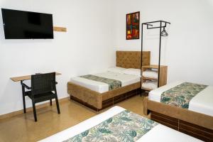 Postel nebo postele na pokoji v ubytování Hotel Central Plaza Medellin