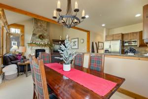 a kitchen and living room with a dining room table at 6554 Settlers Creek townhouse in Keystone