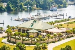 a resort with a marina and boats in the water at Barefoot Beach Haven: Resort Access in North Myrtle Beach