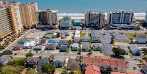 an aerial view of a city with buildings and the ocean at Sand Dollar - 3rd Row - Ocean Drive Section in Myrtle Beach