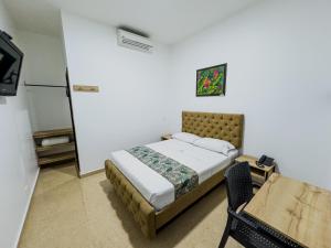 Postel nebo postele na pokoji v ubytování Hotel Central Plaza Medellin