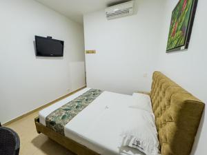 Postel nebo postele na pokoji v ubytování Hotel Central Plaza Medellin