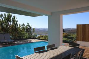a house with a swimming pool with a view at H36 Pine Villa in Aljezur