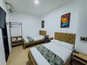 Postel nebo postele na pokoji v ubytování Hotel Central Plaza Medellin