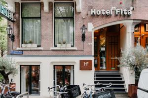 a hotel with bikes parked outside of it at Hotel Fita in Amsterdam