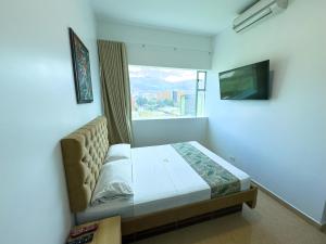 Postel nebo postele na pokoji v ubytování Hotel Central Plaza Medellin