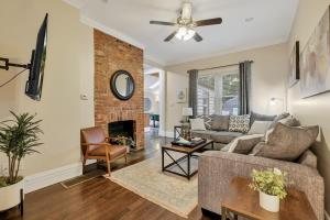 a living room with a couch and a fireplace at OSU and Short North 4 Bedroom Patio and Garage with EV in Columbus