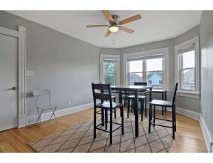a dining room with a table and chairs at Housepitality - The Franklinton Crown - Location in Columbus