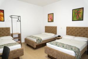 Postel nebo postele na pokoji v ubytování Hotel Central Plaza Medellin