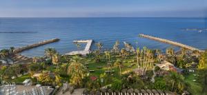 an aerial view of a resort near the ocean at Amathus Beach Hotel Limassol in Limassol