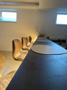 a long table in a room with chairs at Gastpark Hotel in Manching