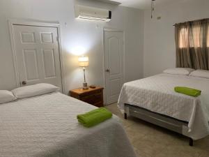 En eller flere senge i et værelse på Complejo Deportivo Wilson Palacios