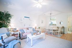 a living room with a couch and a table at Barefoot Resort - Arbor Trace 523 - Windy Hill in North Myrtle Beach