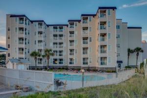 um grande edifício de apartamentos com piscina em A Place At The Beach WH 308 - Oceanfront - Windy Hill Section em Myrtle Beach