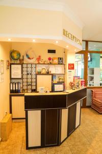 a restaurant with a counter in a store at Family hotel Deykin in Sunny Beach