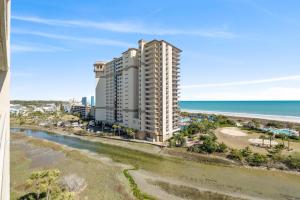 an aerial view of a building next to the beach at Ocean Creek Resort E8 -Oceanfront - Windy Hill in Myrtle Beach
