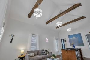 a living room with a couch and two lights at The Village Cottage in Columbus