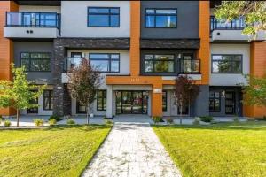 an exterior view of a building with a lawn at Gem Havana 3 bedroom home in Calgary