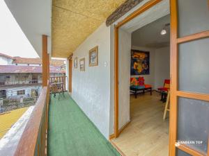 a balcony with a view of a living room at Central Plaza Apartments in Cusco