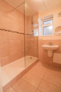 a bathroom with a shower and a sink at Fantastic 2 Bed London Apartment in London