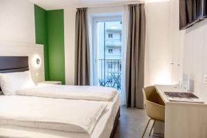 Katil atau katil-katil dalam bilik di Miralago Locarno Easy Rooms