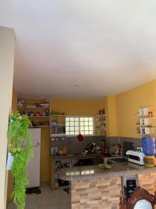 a kitchen with yellow walls and a counter top at CASA SAN JACINTO in San Jacinto