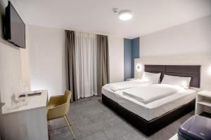 Katil atau katil-katil dalam bilik di Miralago Locarno Easy Rooms