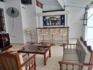 a living room with a couch and a table at Casa Maikai Tarapoto in Tarapoto