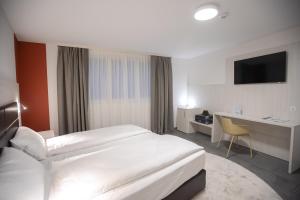 Katil atau katil-katil dalam bilik di Miralago Locarno Easy Rooms