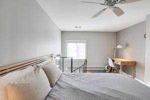 a bedroom with a bed and a ceiling fan at Provincetown Condo Walk to the Beach! in Provincetown