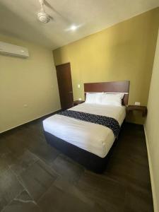 Giường trong phòng chung tại REGMAR Progreso Yucatán