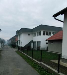 a row of houses on the side of a road at Apartman Marina stan na dan in Prijedor