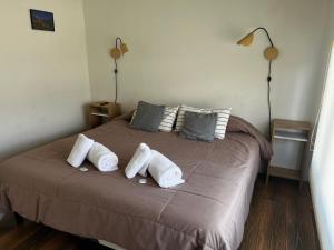 Una cama o camas en una habitación de Buenavista Chalten, Casa de Montaña