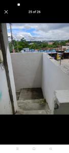 een trap naar een witte muur bij Yang guest house/private room in Dauis