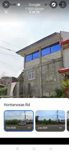 een gebouw met een bus ervoor bij Yang guest house/private room in Dauis