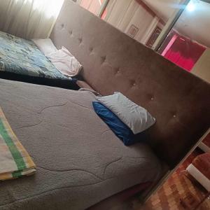 Postel nebo postele na pokoji v ubytování Agradable minidepartamento central en Ambato, para una a seis personas