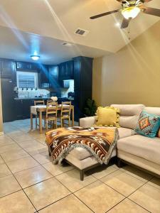 a living room with a couch and a table at Western Style - 2 bed/1 bath (RATED 10 STARS) in Eagle Pass