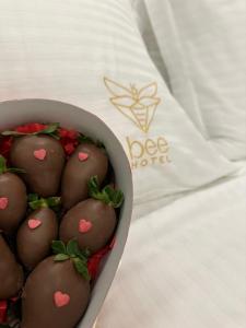 a bowl of chocolate cookies with hearts on them at Bee Hotel in Vlorë
