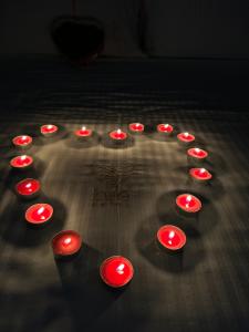 a group of red lights in the shape of a heart at Bee Hotel in Vlorë