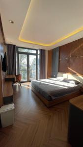 Postel nebo postele na pokoji v ubytování Twin Villa Đà Lạt