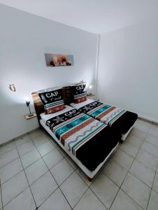 Postel nebo postele na pokoji v ubytování Le Nil Appartement Cosy tout confort + 8 fotografií