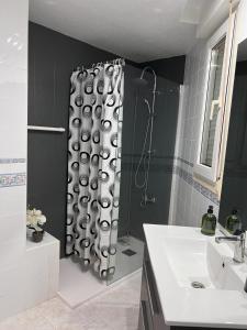 a shower curtain in a bathroom with a sink at Apartamento en Vinaros in Vinarós