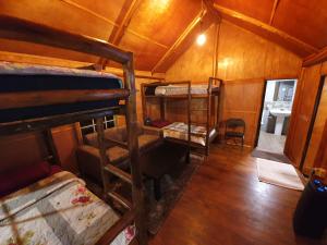 an overhead view of a room with bunk beds at Charley's Heaven Ambewela in Ambawela